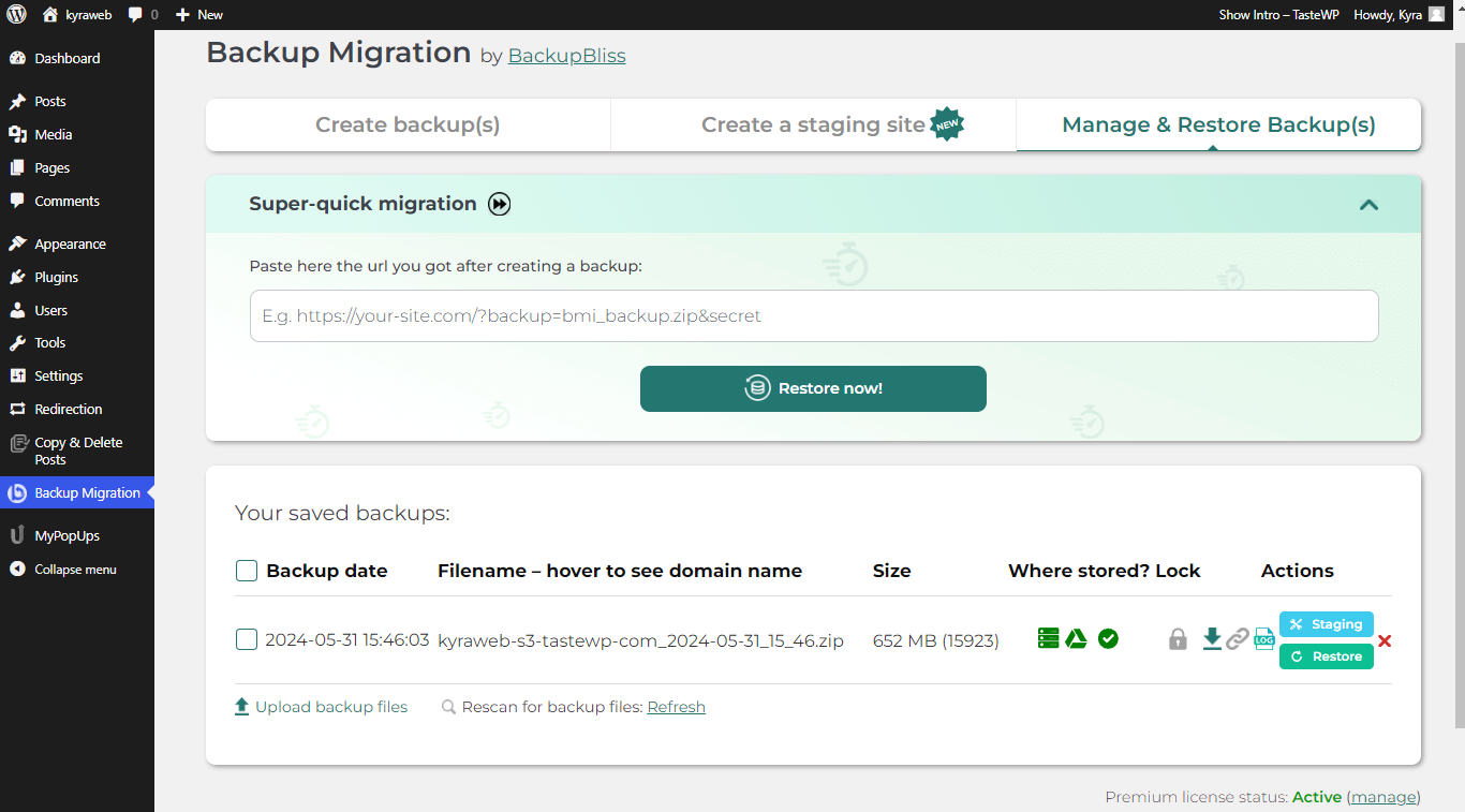 WordPress dashboard with the Backup Migration plugin open to the "Manage & Restore Backup(s)" tab. It shows options to create backups, create a staging site, and manage or restore backups. A field to paste a URL for quick migration is also visible, along with a list of saved backups.